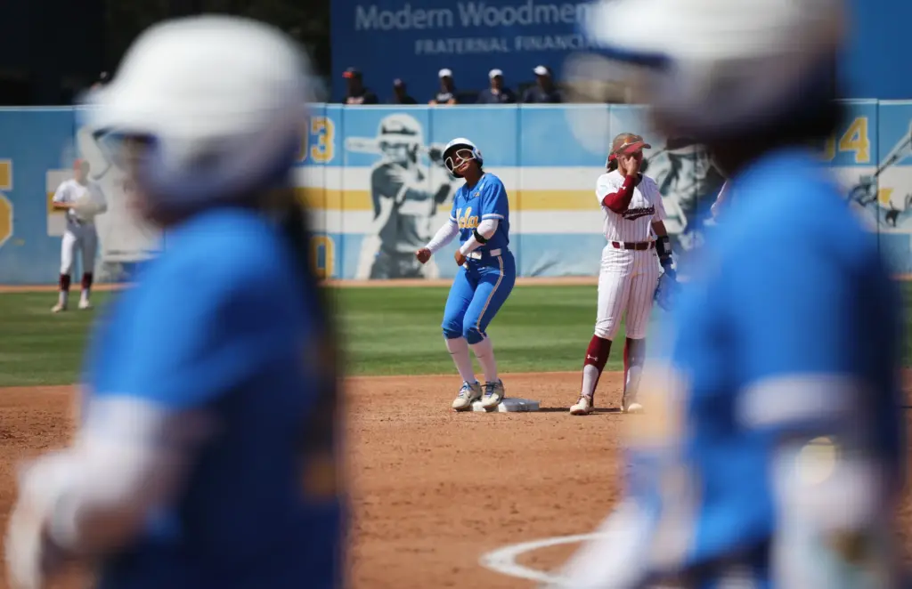 UCLAâs Soo-Jin Berry (11) celebrates after driving in two runs...