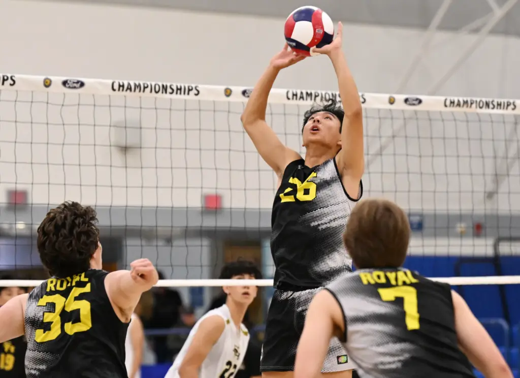 Micah Park #26 of the Royal Highlanders sets up a...