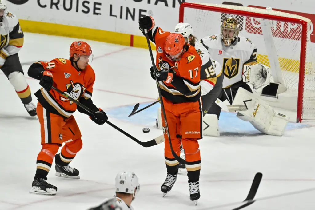 The Ducksâ Alex Killorn (17) stops a puck against the...