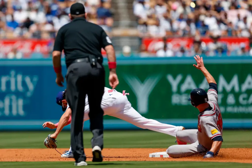 Dodgers second baseman Alex Freeland forces out Atlanta Braves’ Eli...