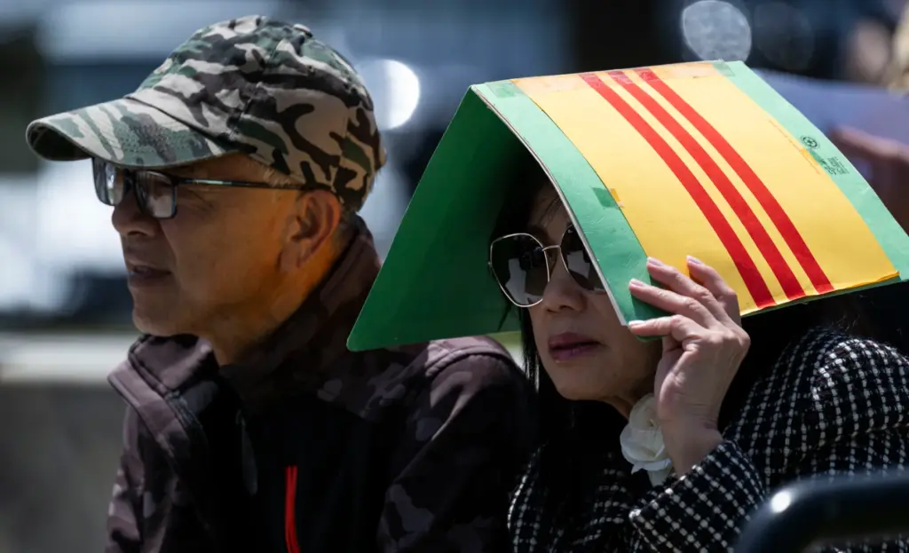 People listen to speakers during a Black April Remembrance Ceremony...