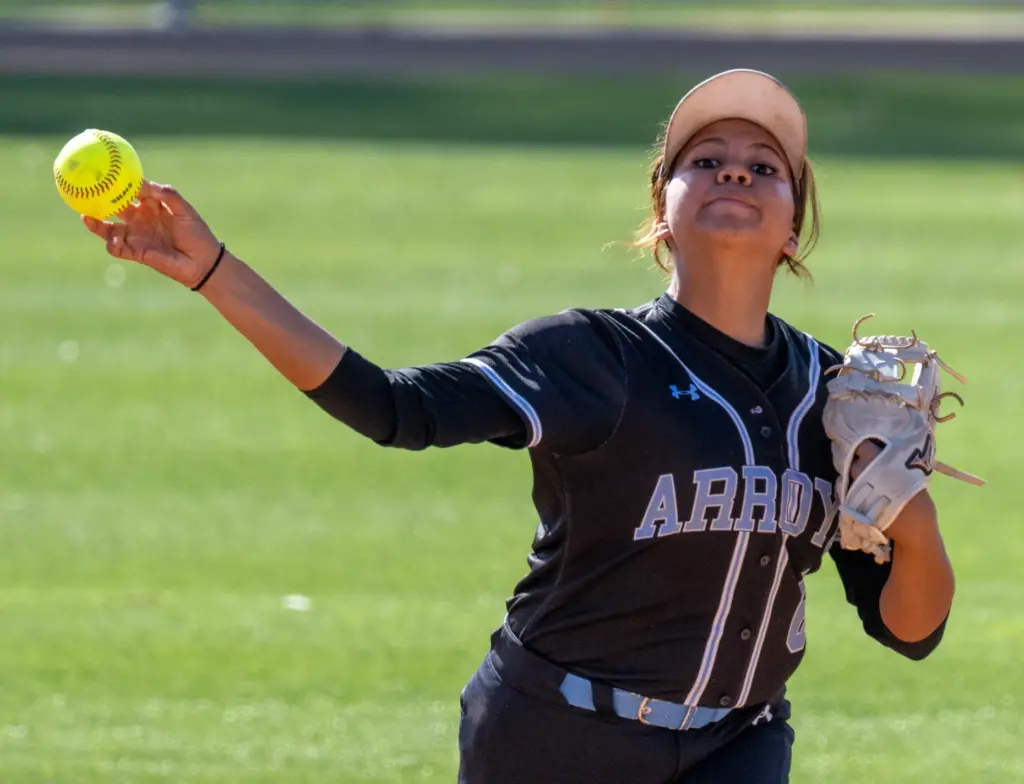 Arroyo shortstop Melanie Borgen throws to first base for an...