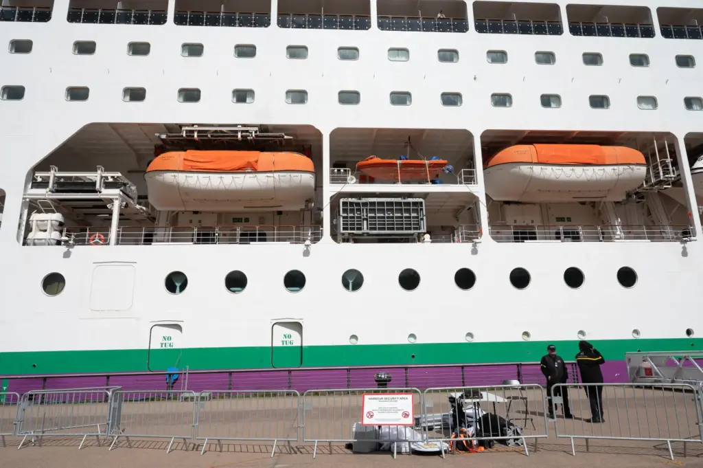A barrier is set in front of the British cruise ship Ambition.