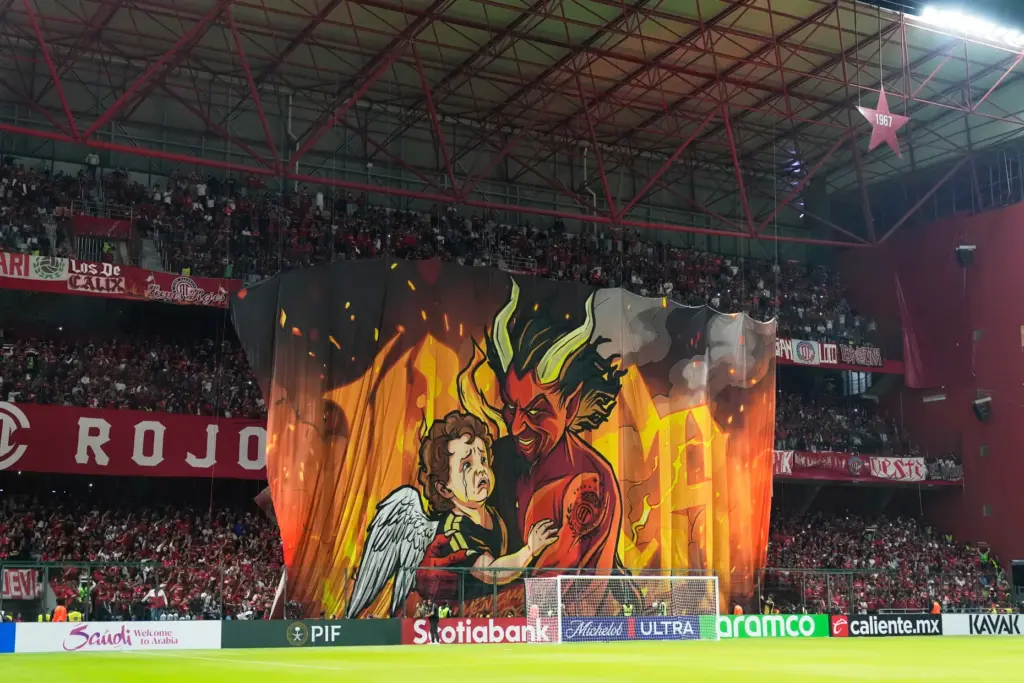Fans of Mexico’s Toluca FC display a banner before during...
