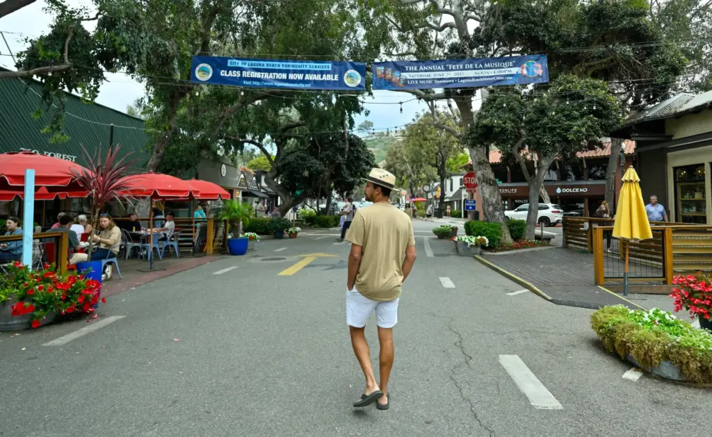 Humberto Gonzales, visiting from Phoenix, walks along Forest Avenue in...