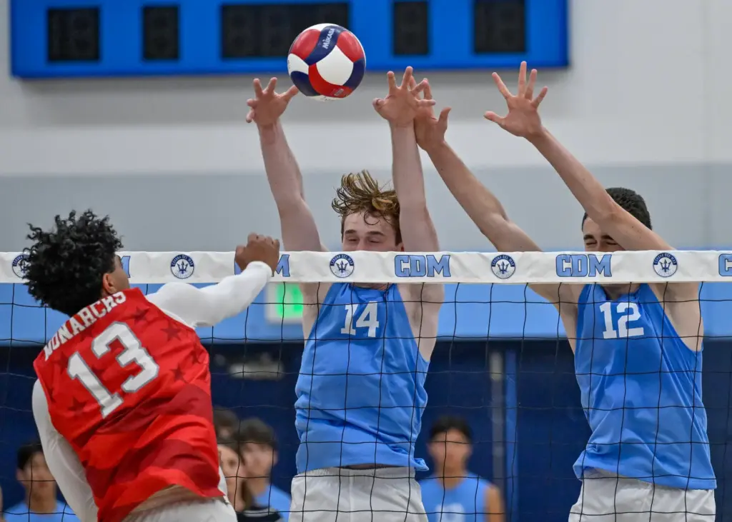 Corona del Marâs Brady Gant, center, and Daniel Booker block...