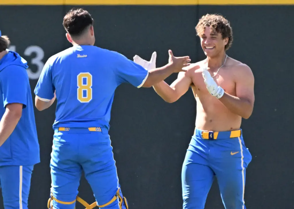 Phoenix Call #4 of the UCLA Bruins celebrates with teammate...