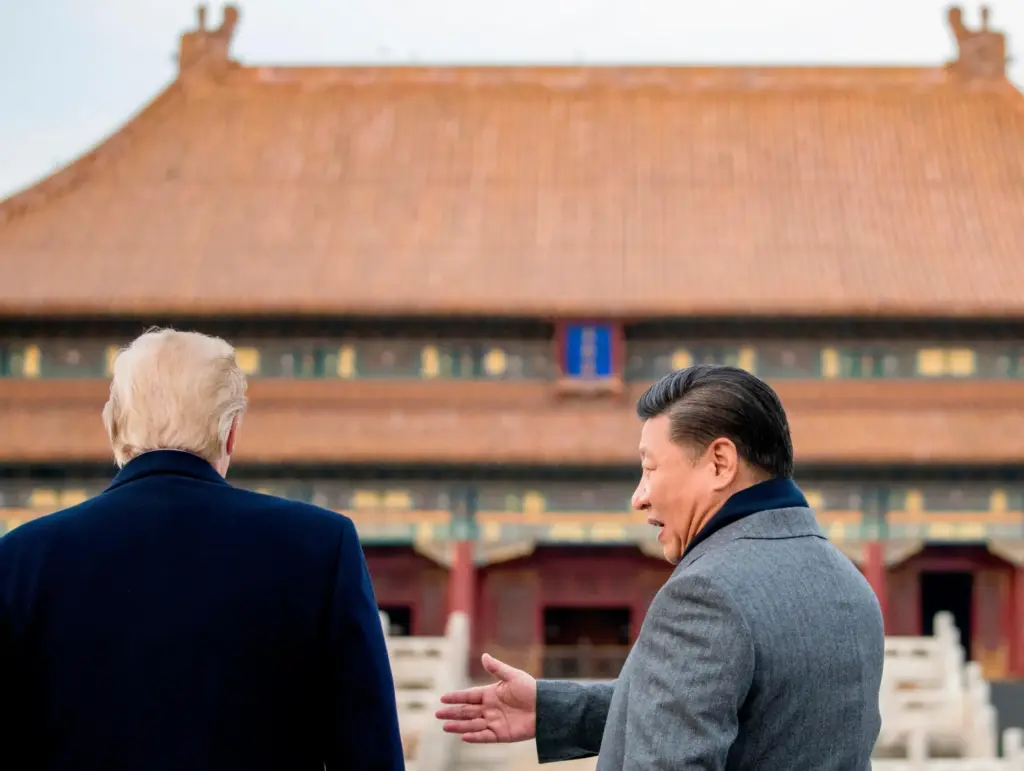 FILE – President Donald Trump and Chinese President Xi Jinping...