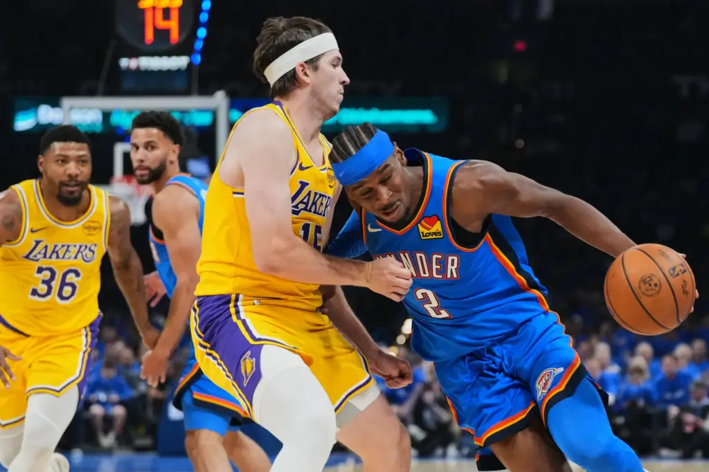 Oklahoma City Thunder guard Shai Gilgeous-Alexander drives to the basket...