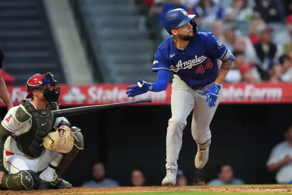 The Dodgers’ Andy Pages drops his bat as he watches...