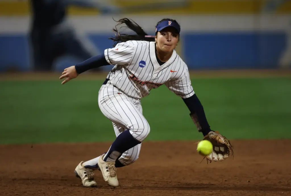 Cal State Fullertonâs Sarah Coccillos tracks down a ground ball...