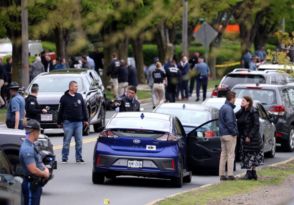 Police respond to the scene of a shooting on Monday,...