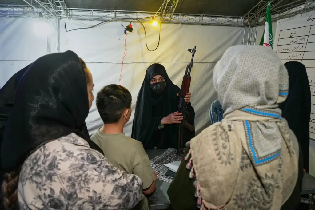 A member of the Revolutionary Guard’s volunteer Basij force demonstrates...
