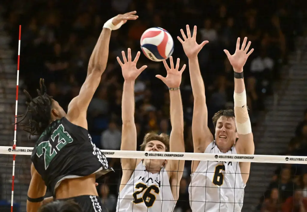 Hawaiiâs Louis Skanoko spikes the ball against Long Beach State...