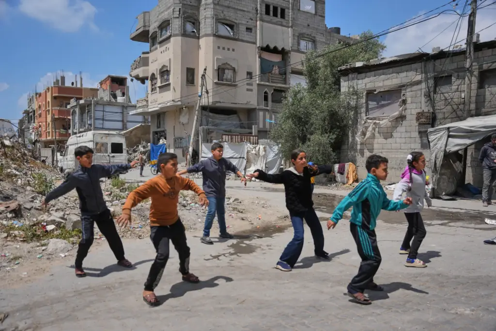 Palestinian children practice breakdancing outside a dance studio