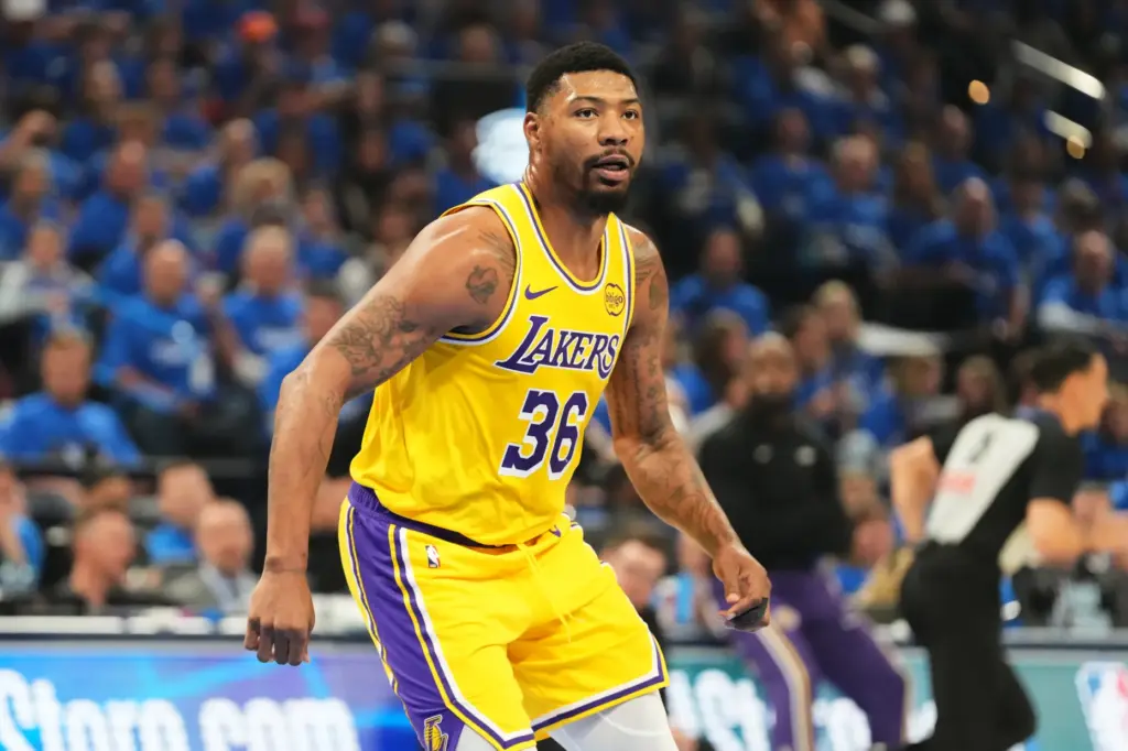 Lakers guard Marcus Smart competes during the first half of...