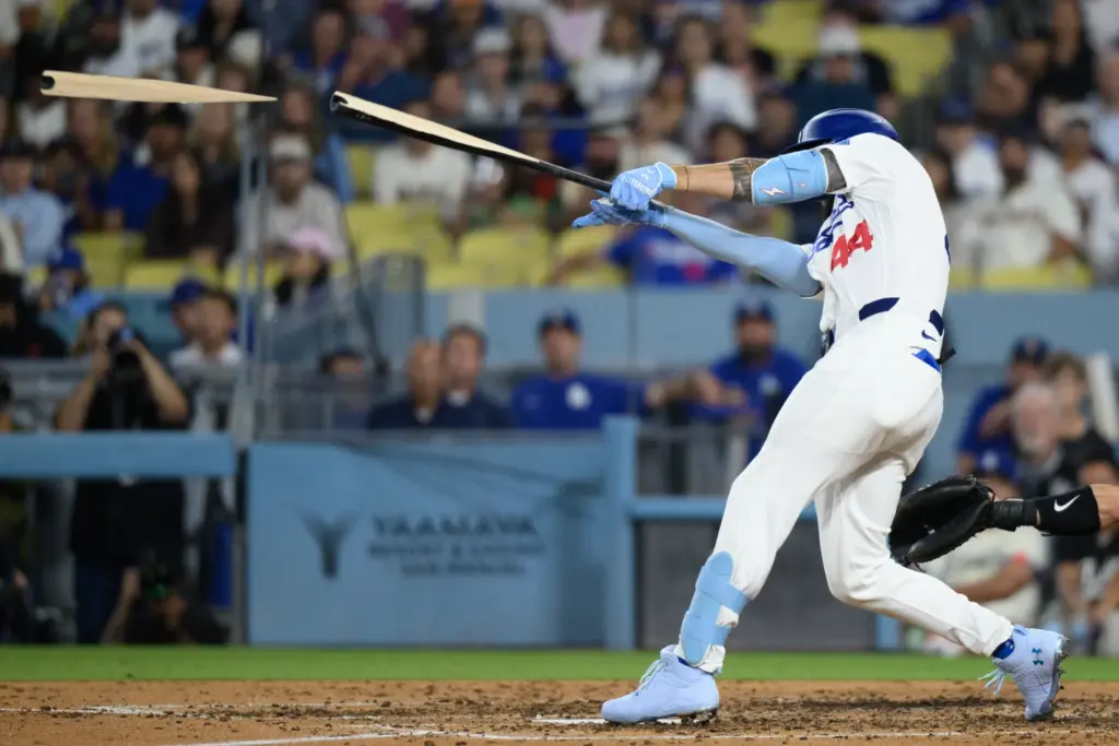 The Dodgers’ Andy Pages breaks his bat while hitting int...