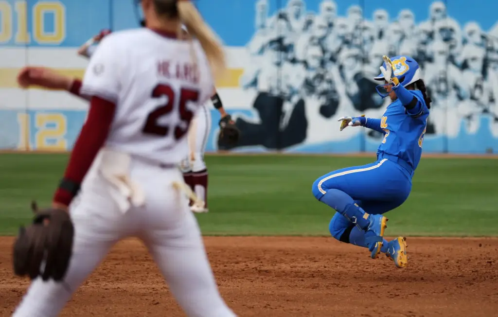 UCLAâs Bri Alejandre begins to slide into second base during...
