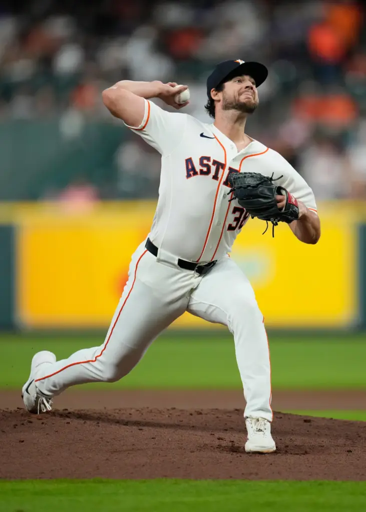 Houston Astros starting pitcher Peter Lambert throws to the plate...