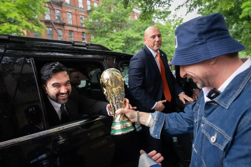New York Mayor Zohran Mamdani is passed a replica World...