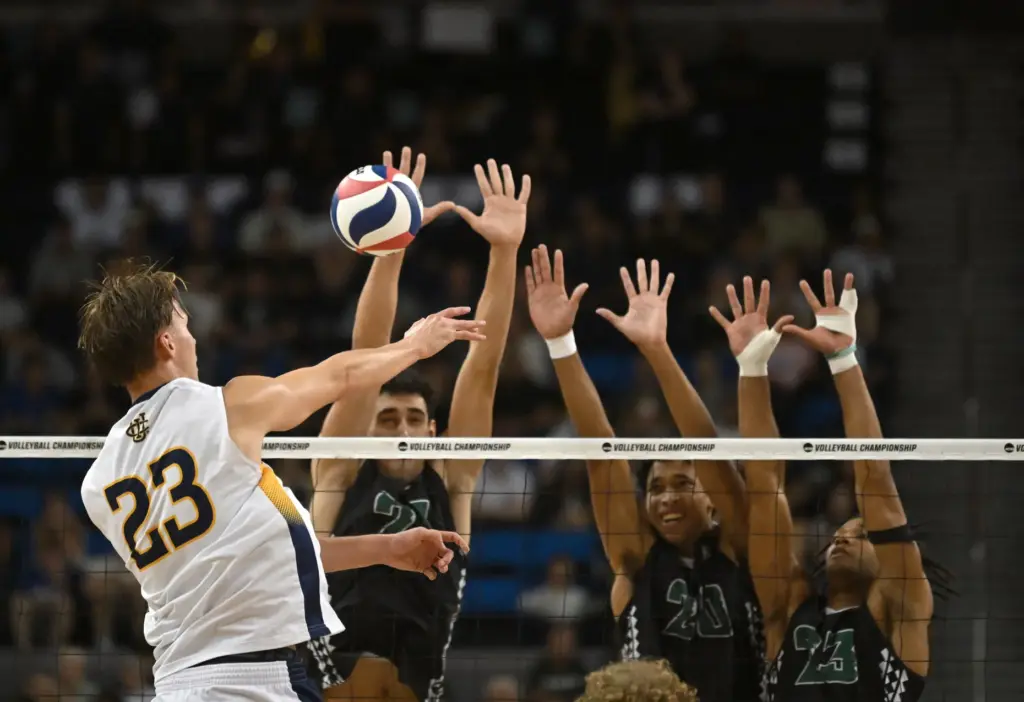 UC Irvineâs Andreas Brinck, left, hits into a block during...