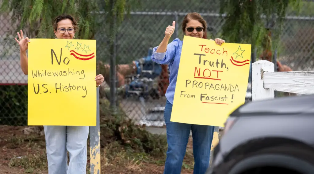 Protesters rally Friday, May 8, 2026, outside Canyon Hills Junior...