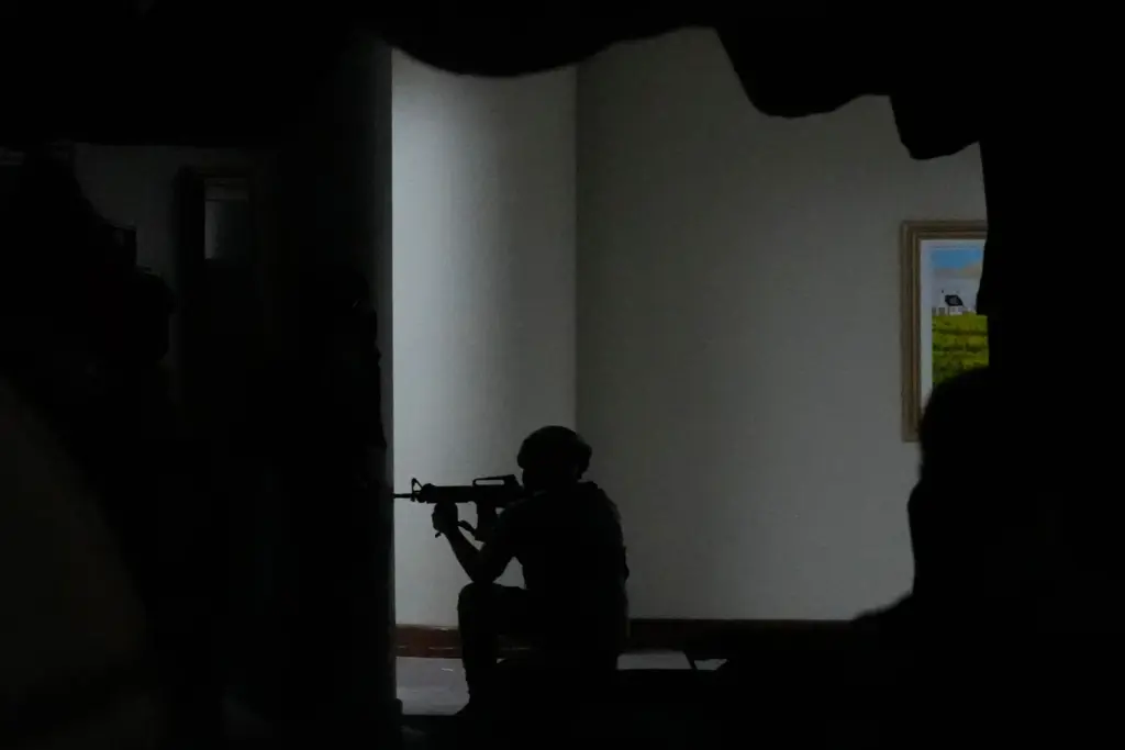 Philippine troopers secure an area after gunfire was heard at...