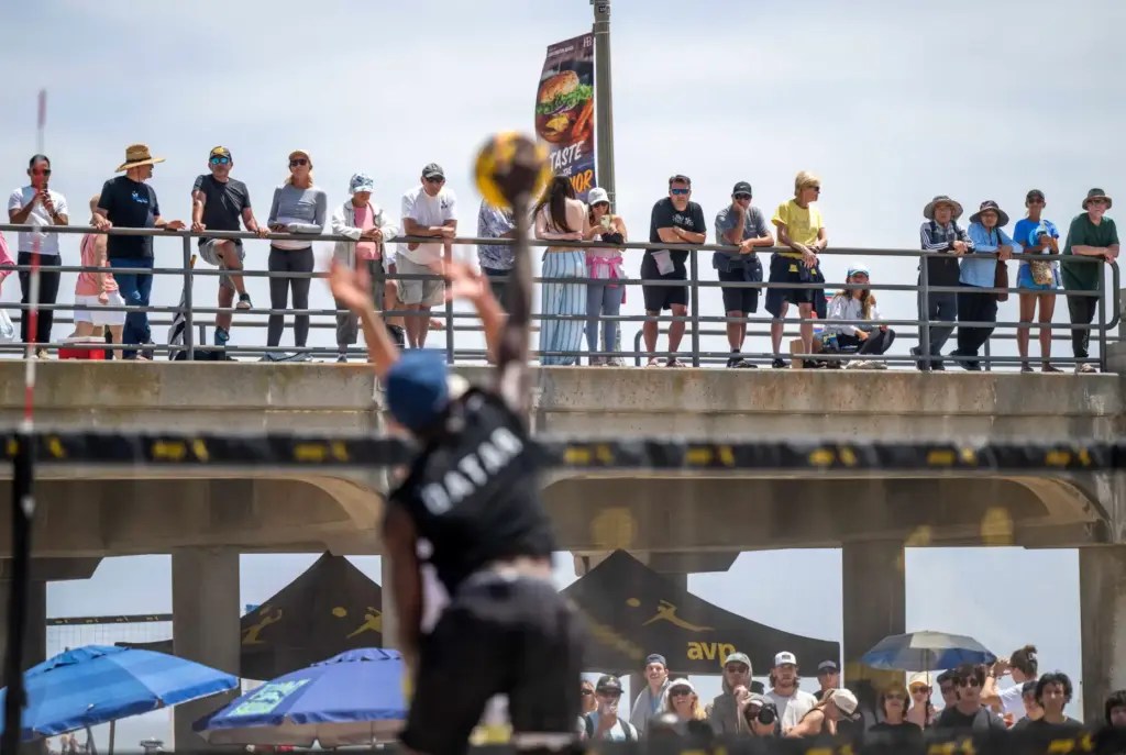 Fans watch matches from the pier during the AVP Huntington...
