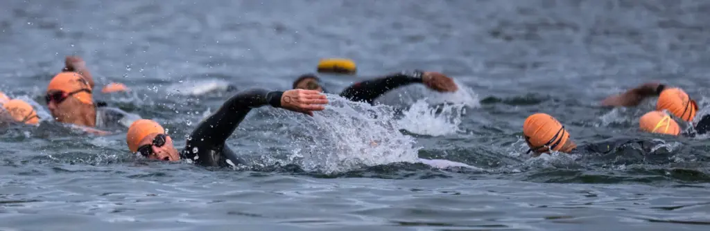 Swimmers hit the water during the OC Tri Series in...