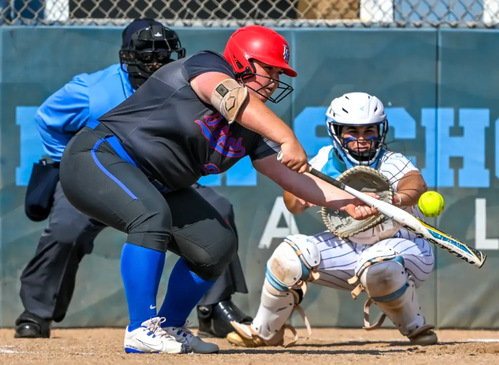 Los Alamitosâs Faith Pulsifer hits the ball during a Sunset...
