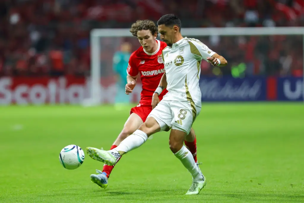 LAFC’s Marco Delgado, right, battles for the ball with Toluca...
