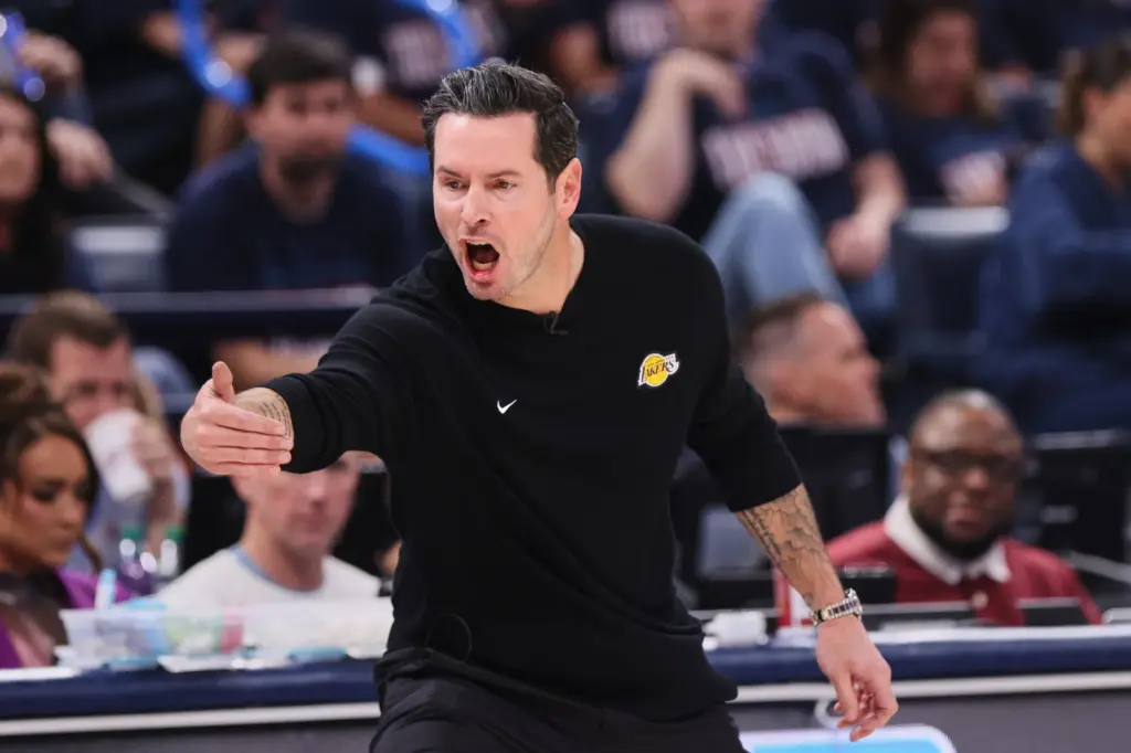 Los Angeles Lakers head coach JJ Redick reacts to play...