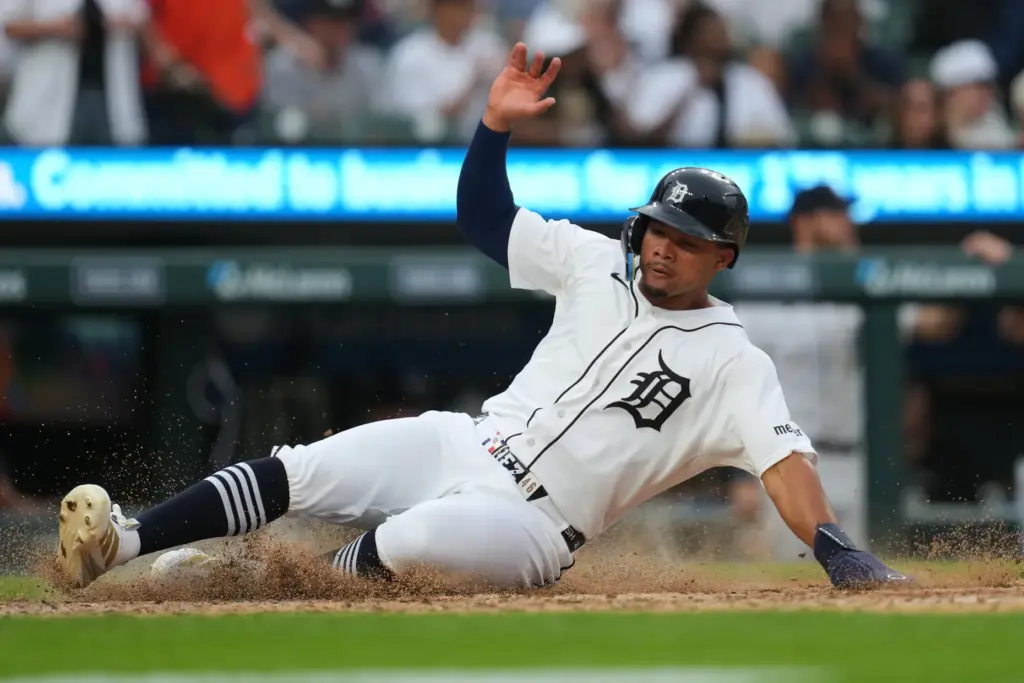 The Detroit Tigers’ Wenceel PÃ©rez slides safely into home plate...
