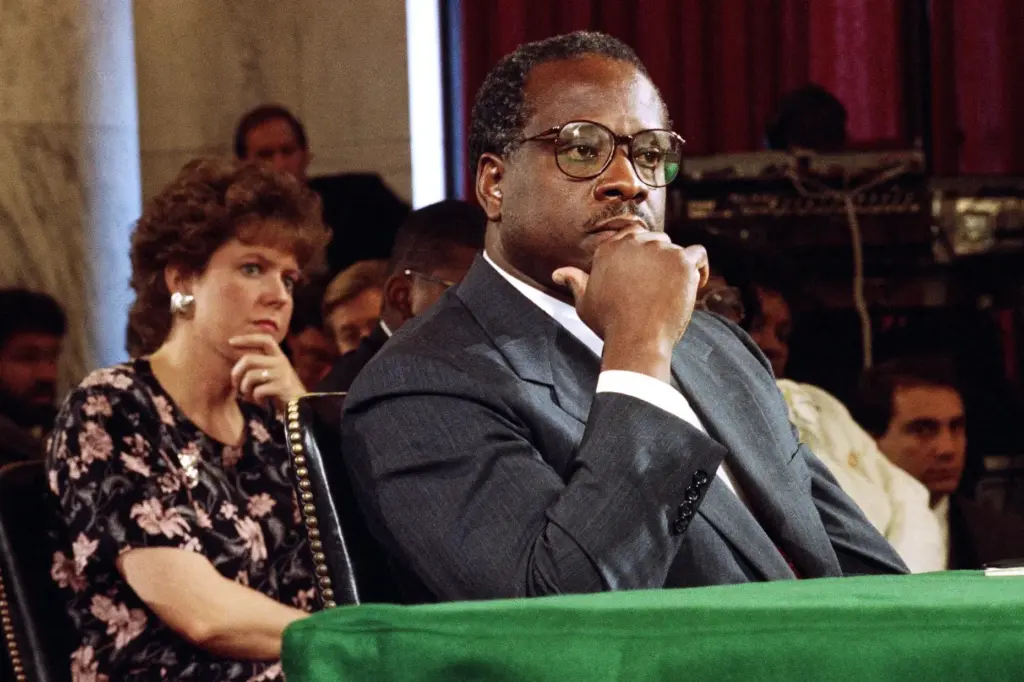 Supreme Court Justice Nominee Clarence Thomas and his wife, Virginia, listen during his nomination hearing.