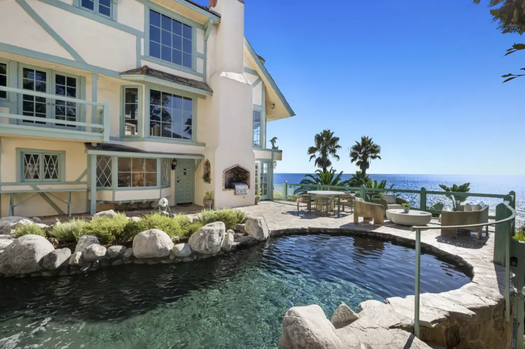 The attached guest quarters has a private entrance off the...