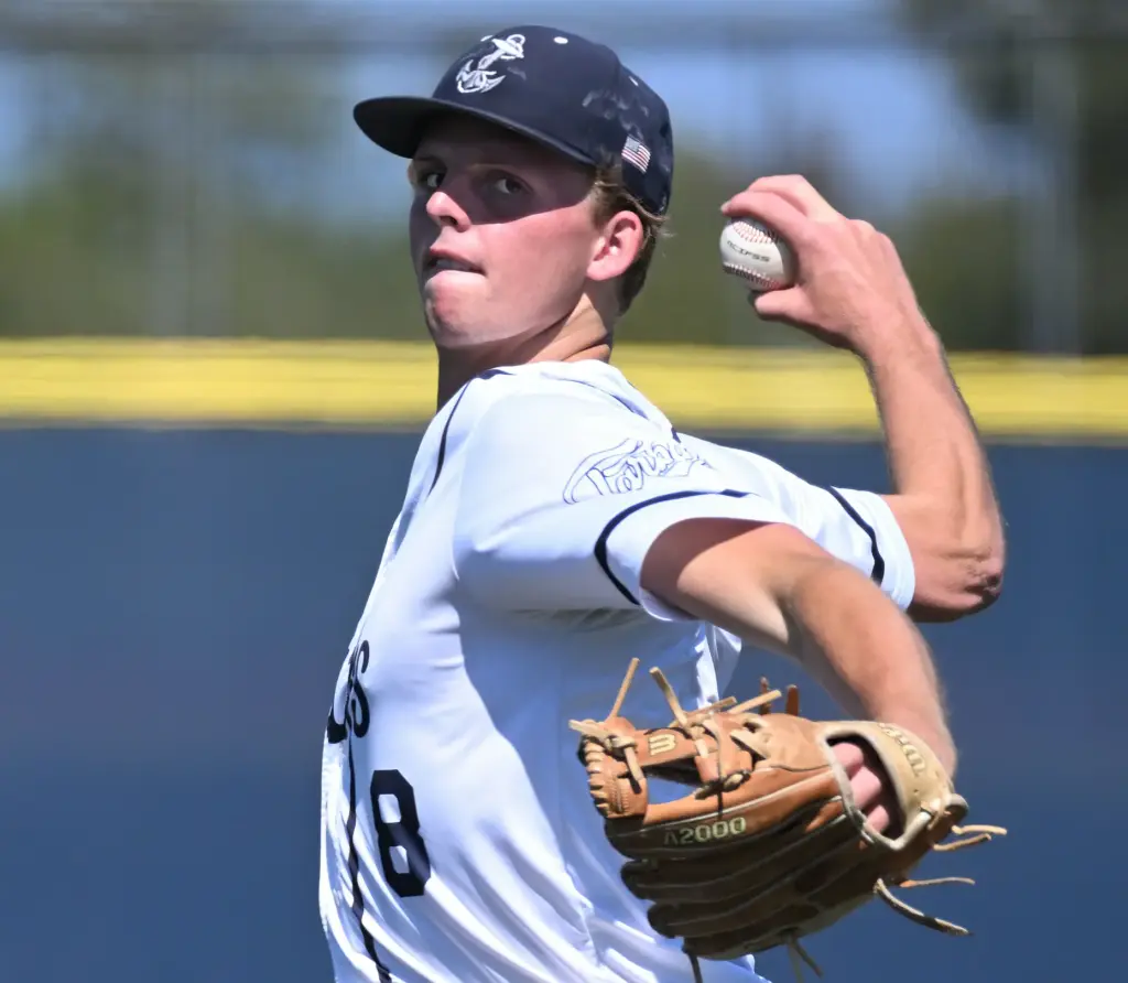 Gavin Guy (8) of Newport Harbor pitches against Trabuco Hills...
