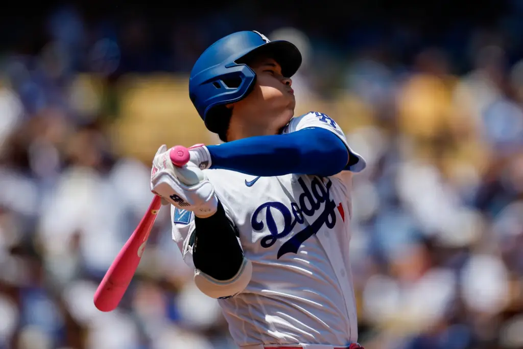 Dodgers designated hitter Shohei Ohtani strikes out swinging during the...
