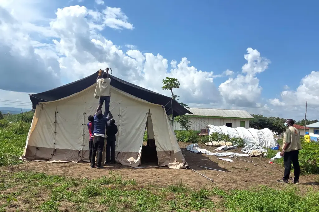 Aid workers set up an Ebola treatment center in Rwampara, Congo.