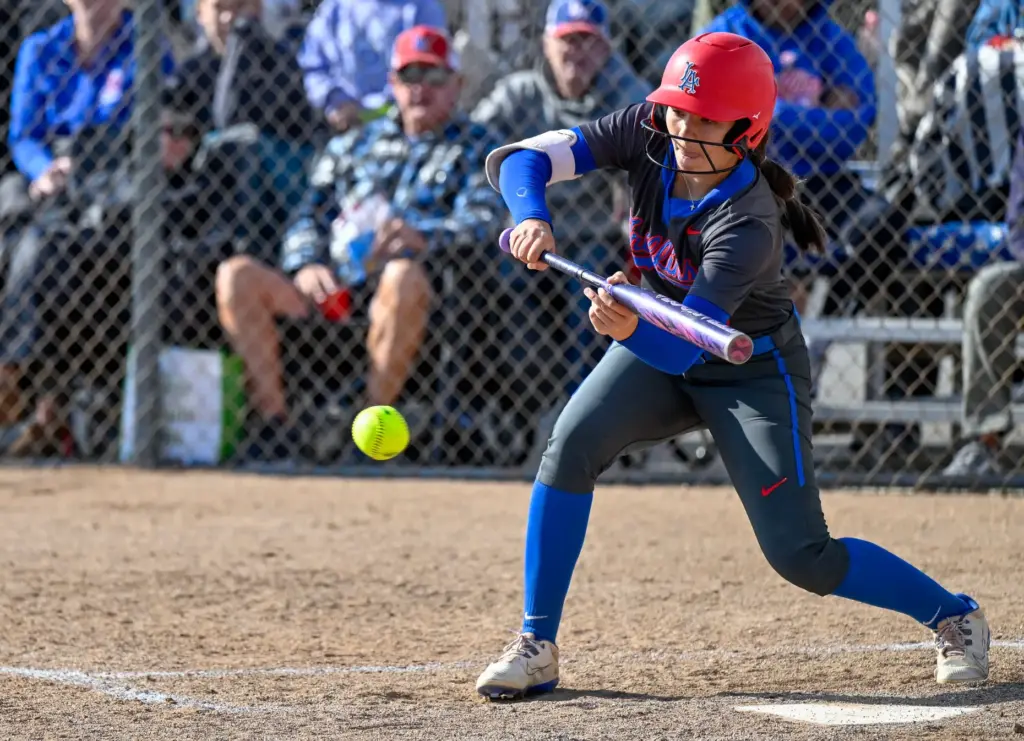 Los Alamitos outfielder Julia Gordon bunts during a Sunset League...
