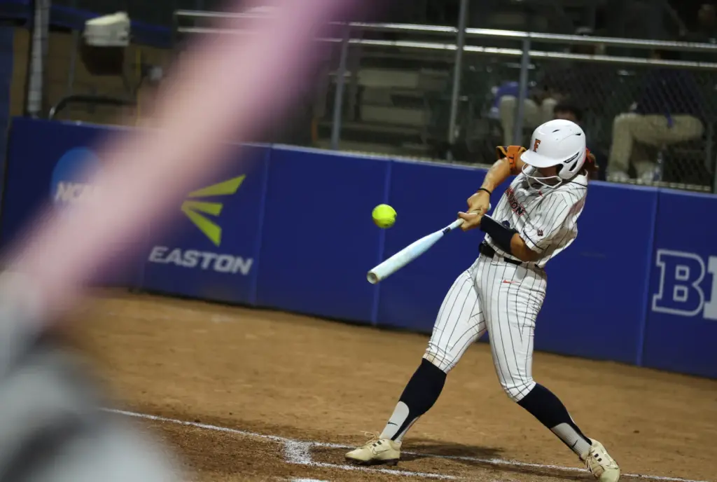 Cal State Fullertonâs Ava Arce makes contact while at-bat against...