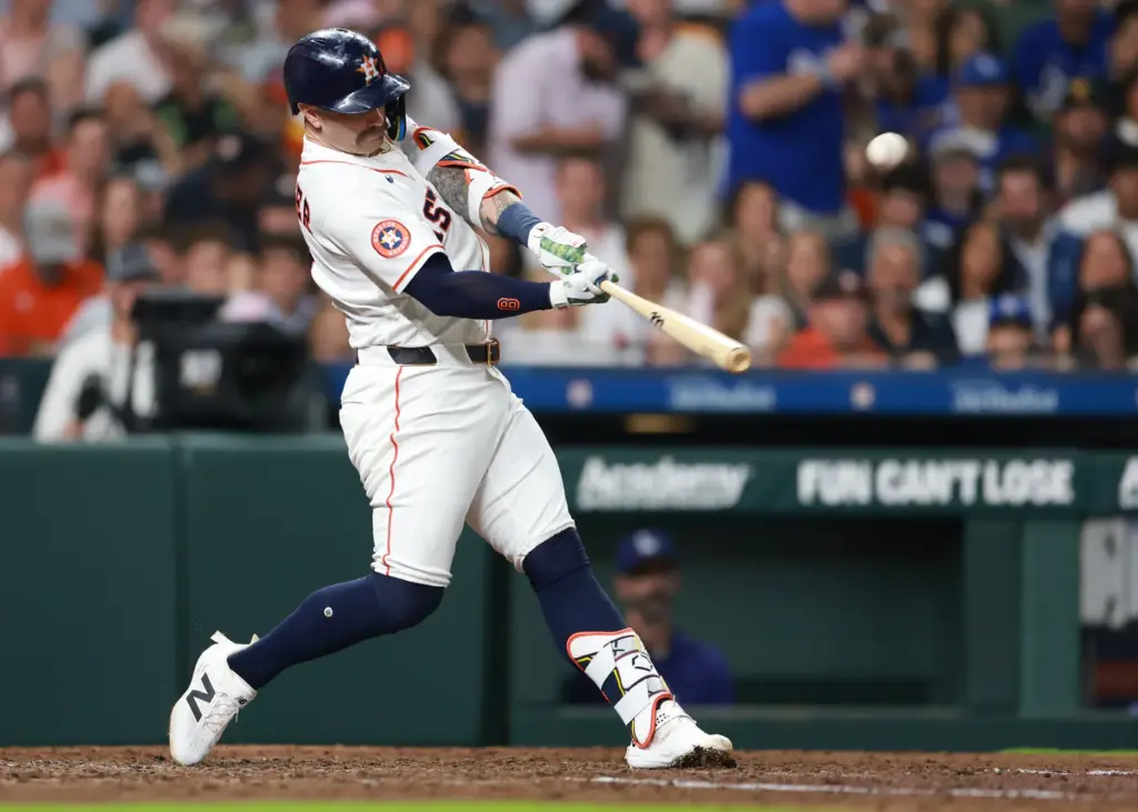 The Houston Astros’ Christian Walker connects with a pitch during...
