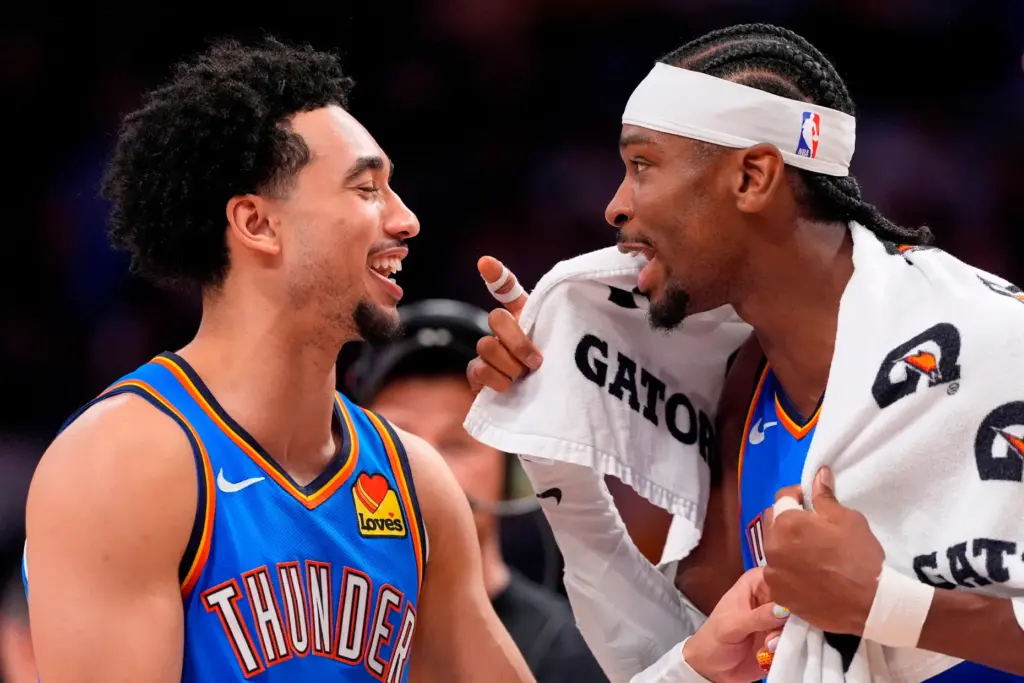 Oklahoma City Thunder guards Jared McCain, left, and Shai Gilgeous-Alexander...