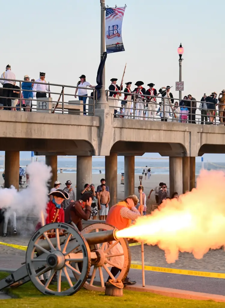 The Naval Historical Education Foundation performs a canon salute as...