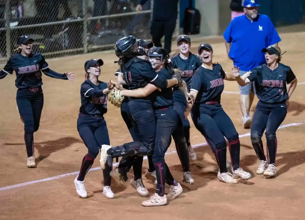 JSerra players celebrate after beating La Mirada 3-2 to win...