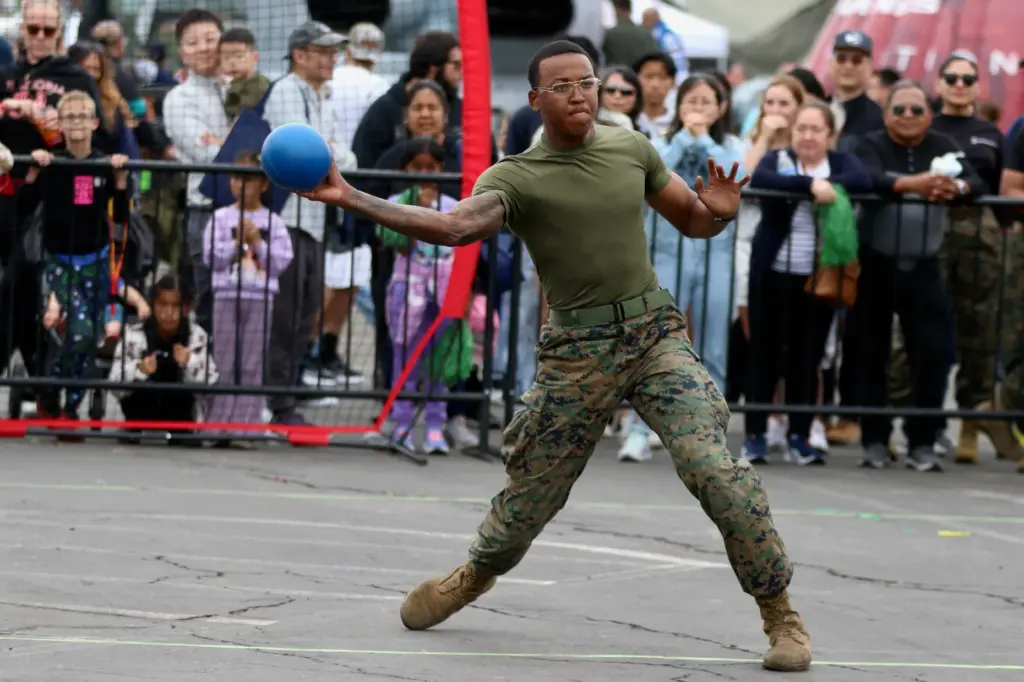 LCpl. Demarcus Reed competes for a team of Marines in...