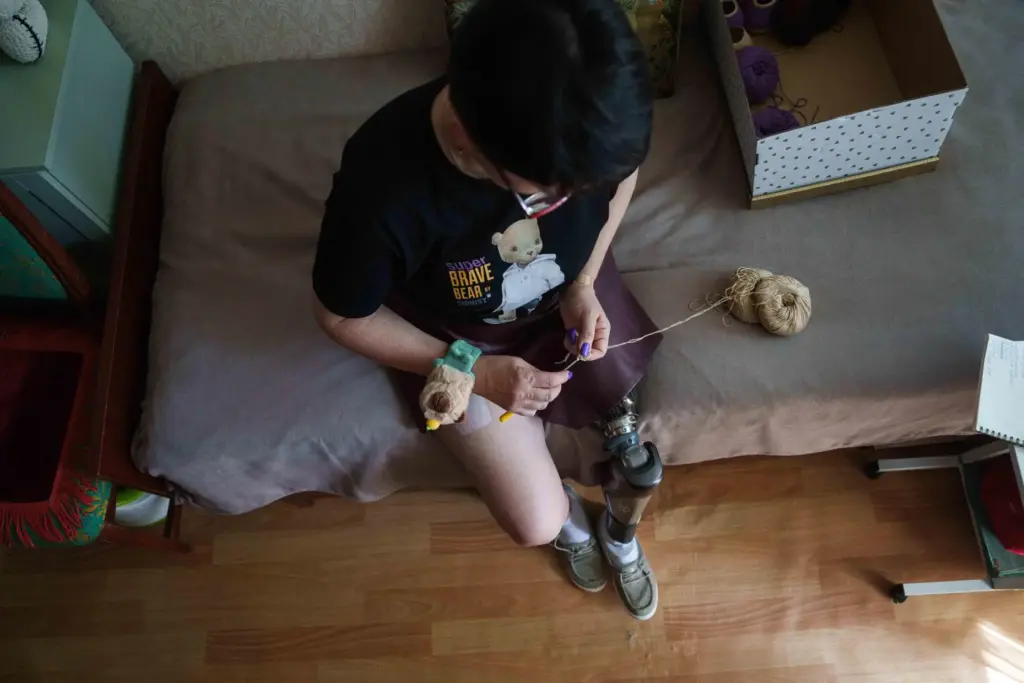 Iryna Nakonechna knits a toy capybara at her home in Kryvyi Rih, Ukraine.
