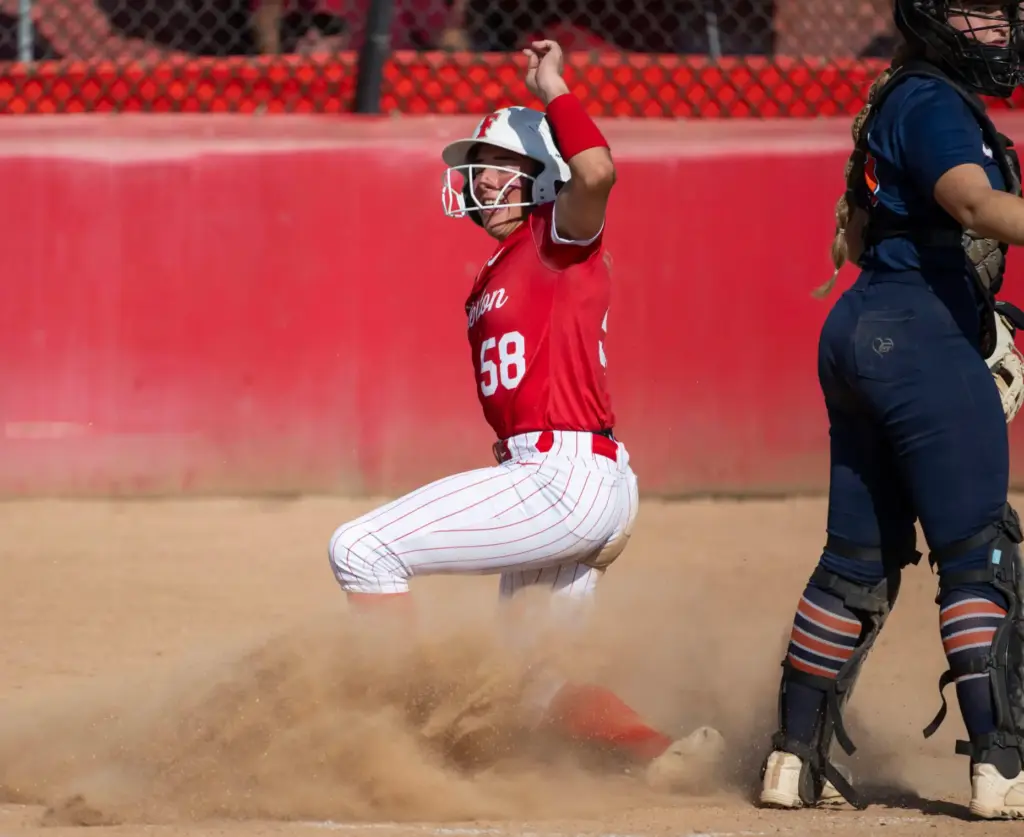 Fullerton’s Soleil Luna scores a run against Cypress as Fullerton...
