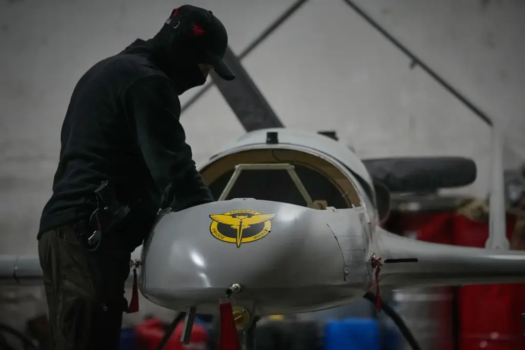 A serviceman of Ukraine's Defence Intelligence prepares an An-196 Liutyi drone.