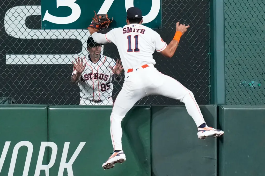 Houston Astros right fielder Cam Smith (11) celebrates with bullpen...