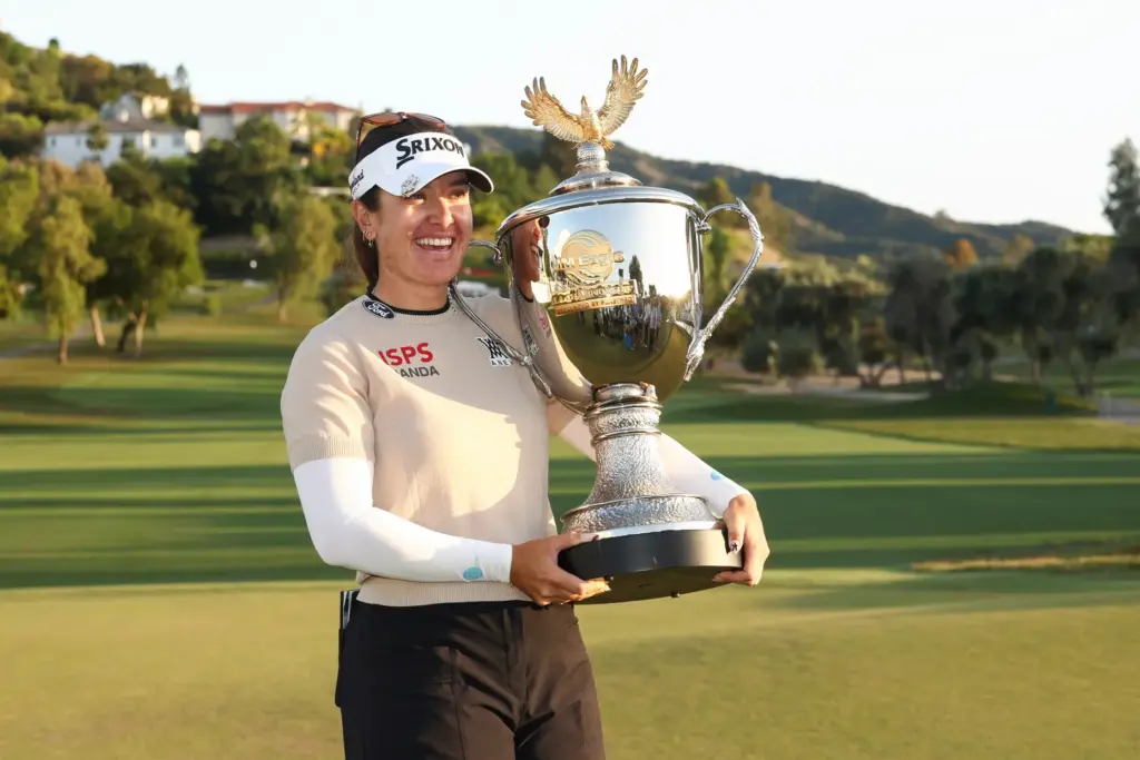 Hannah Green poses with the trophy after winning the LPGA...